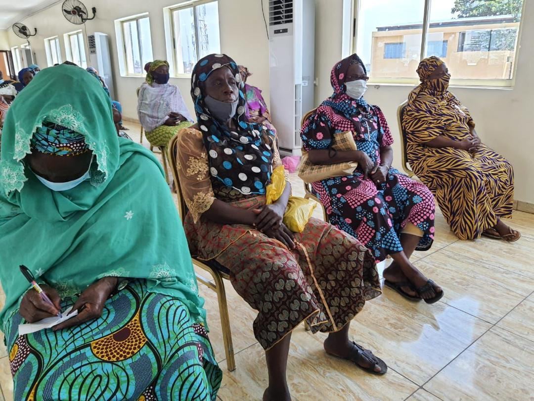 Elderly beneficiaries seated at a Matriarch Foundation program