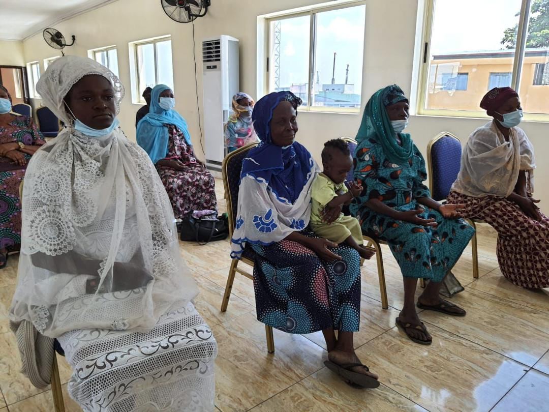 Beneficiaries and family members at an outreach event