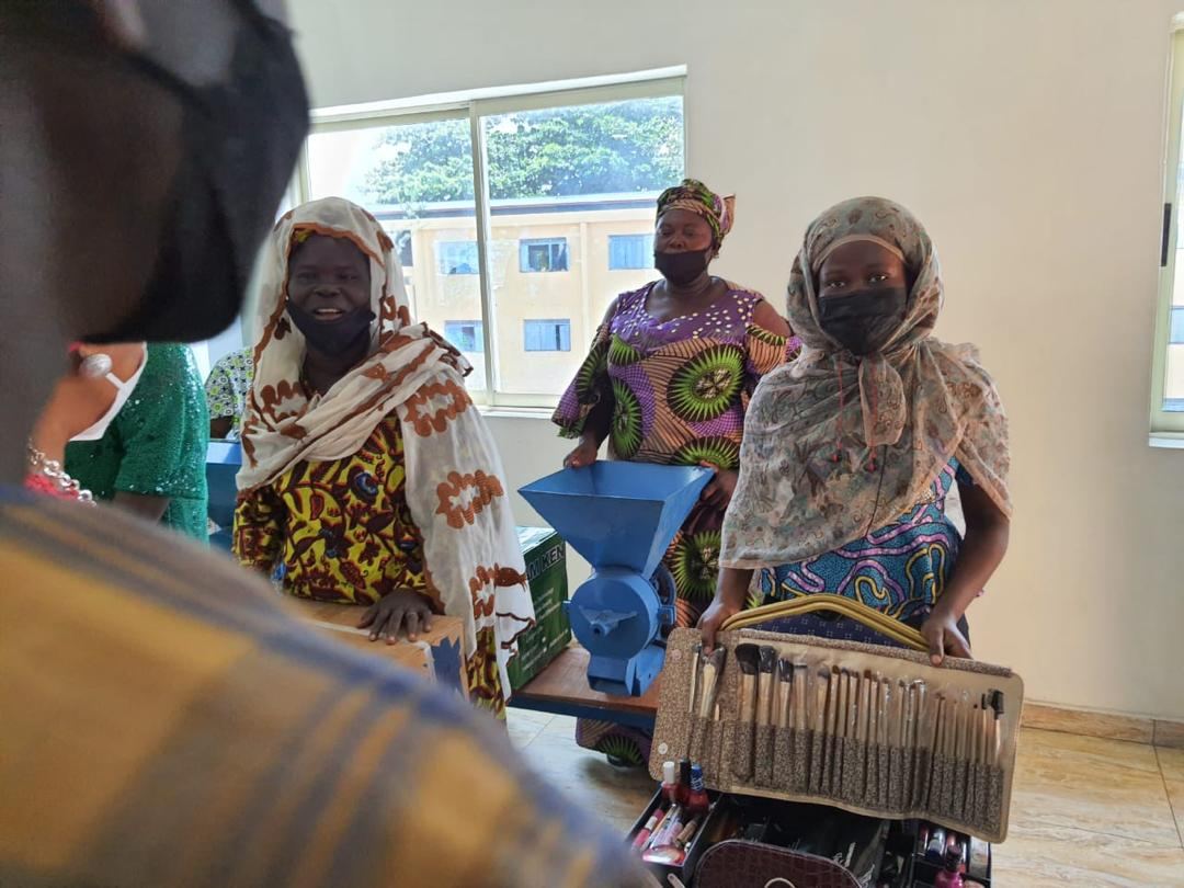 Beneficiaries receiving grinding machines and business starter kits